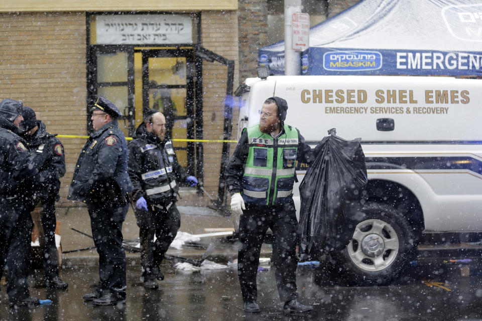 Emergency responders work Wednesday near a kosher supermarket and a synagogue near the site of a shooting in Jersey City, New Jersey. (Photo: ASSOCIATED PRESS)