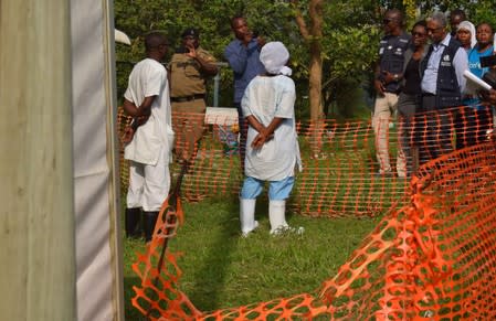 World Health Organization (WHO) officials talk to Ugandan medical staff as they inspect ebola preparedness facilities at the Bwera general hospital near the border with the Democratic Republic of Congo in Bwera