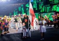 <p>Zahra Nemati won archery gold at the Paralympics in London. Still wheelchair bound, she qualified for the Rio Olympics and was her country’s flag bearer. (Photo by Jamie Squire/Getty Images) </p>