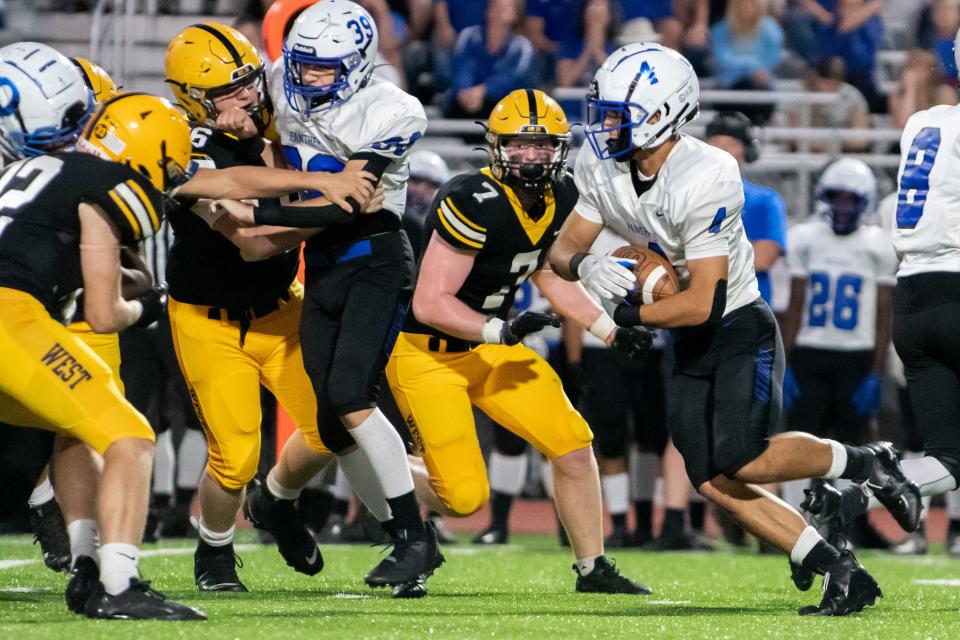 Quakertown running back John Eatherton runs the ball in a football game against Central Bucks West at War Memorial Field in Doylestown Borough on Friday, September 9, 2022. The Bucks won their home opener against the Panthers 56-14.