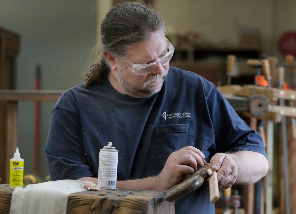 Harp Gallery restoration carpenter Mike Kanieski restores a wooden chest on Thursday, February 10, 2022, in Appleton, Wis.Wm. Glasheen USA TODAY NETWORK-Wisconsin