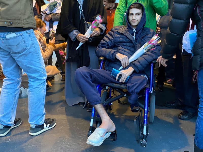 Yussef, a 16-year-old who was evacuated from Gaza to Switzerland, is welcomed upon arrival at Geneva airport