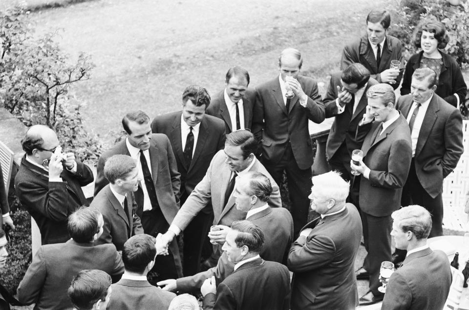 England footballers Nobby Stiles and Alan Ball shake hands with Sean Connery during the England World Cup team visit to