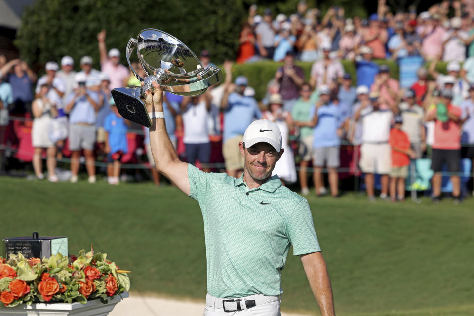 Rory McIlroy celebrates with the trophy after winning the Tour Championship golf tournament at East Lake Golf Club Sunday, Aug. 28, 2022, in Atlanta. (Jason Getz/Atlanta Journal-Constitution via AP)