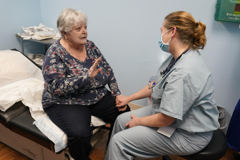 Dr. Catherine Casto, right, talks with Catherine Burns, left, of Millsboro, Del., during a visit to a Chesapeake Health Care office in Salisbury, Md., Thursday, March 2, 2023. Burns has been seeing Dr. Casto for 25 years. (AP Photo/Susan Walsh)