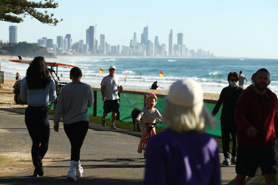 People walk at Burleigh Heads on the Gold Coast, Australia. 