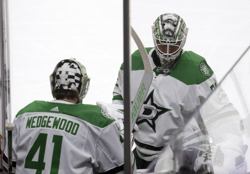 Dallas Stars goaltender Scott Wedgewood, left, replaces goaltender Jake Oettinger during the second period of an NHL hockey game against the Ottawa Senators, Thursday, Feb. 22, 2024 in Ottawa, Ontario. (Adrian Wyld/The Canadian Press via AP)