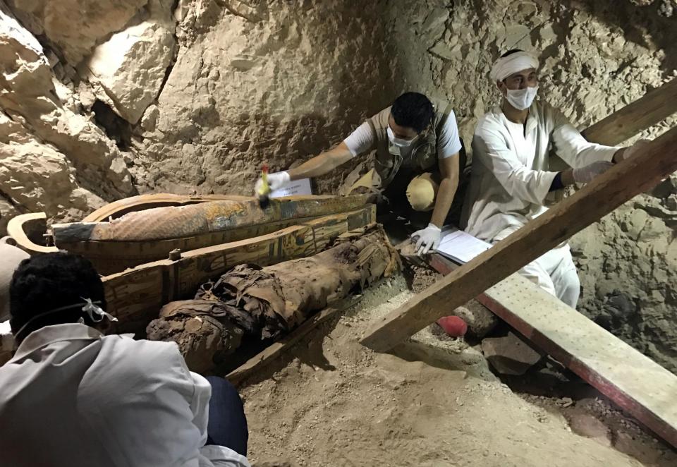 Egyptian antiquities workers are seen in the tomb of Userhat, a judge from the New Kingdom at the Dra Abu-el Naga necropolis near the Nile city of Luxor: Reuters