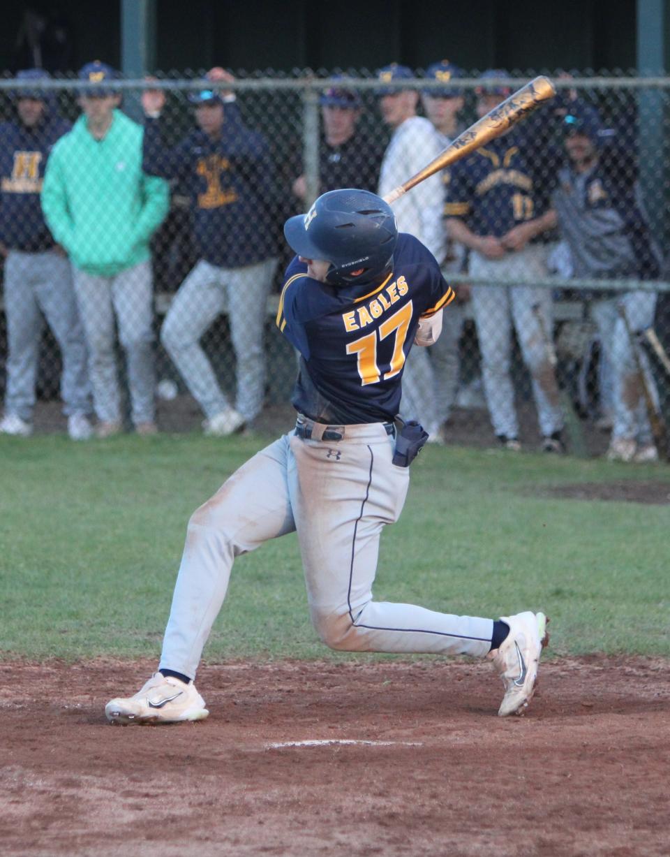 Hartland's Michael Zielinski drives in a run with a single against Howell on Wednesday, May 3, 2023.