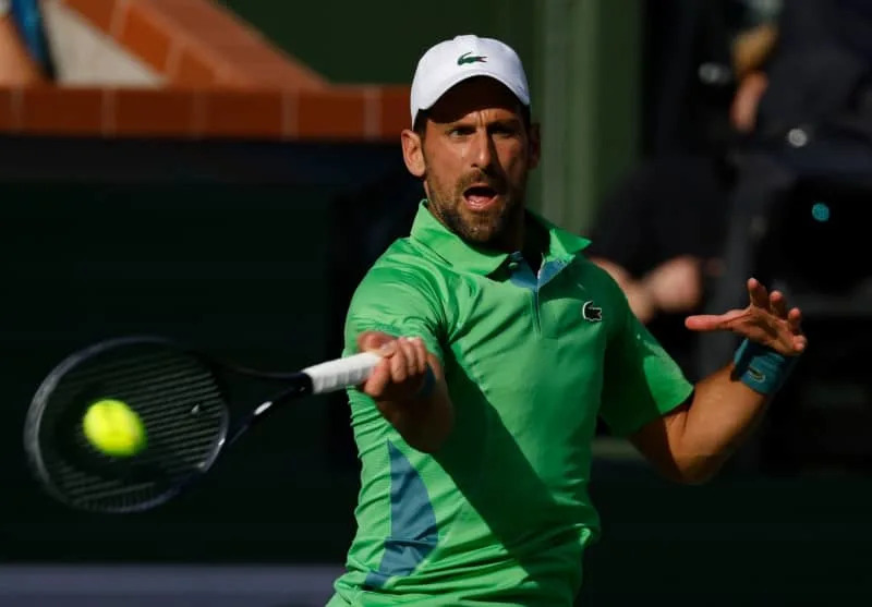 Serbian tennis player Novak Djokovic in action against Australia's Aleksandar Vukic during  their men's singles second round match of the BNP Paribas Open at Indian Wells Tennis Garden. Charles Baus/CSM via ZUMA Press Wire/dpa