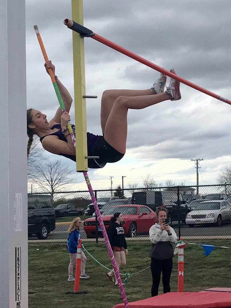 Mount Gilead's Grace Shipman competes in the pole vault during a girls track meet at Highland last spring.