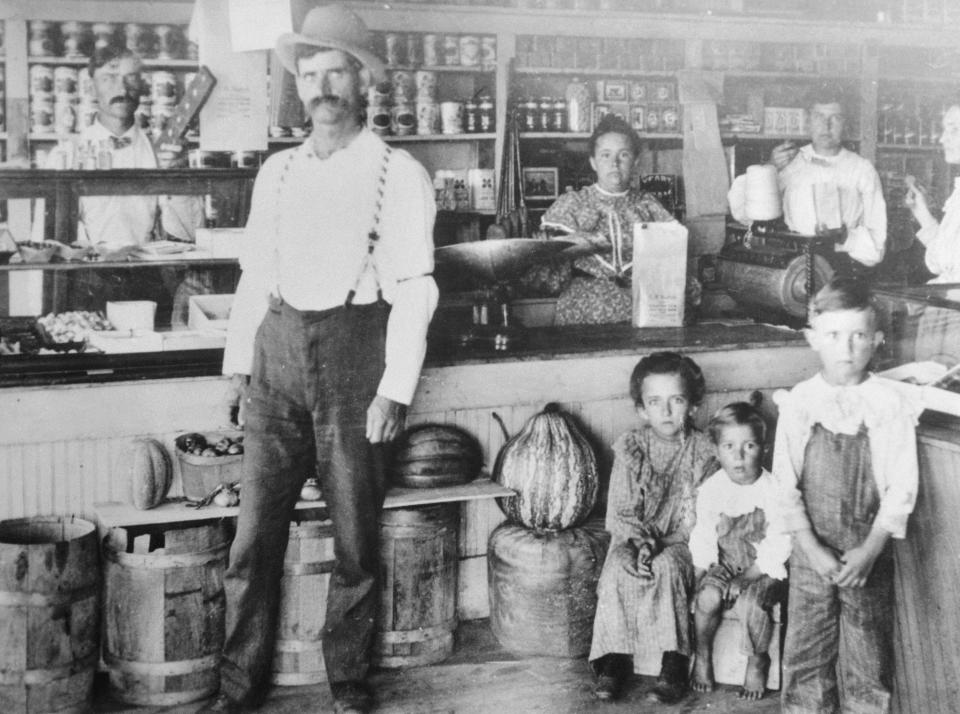 A working class family in a general store.