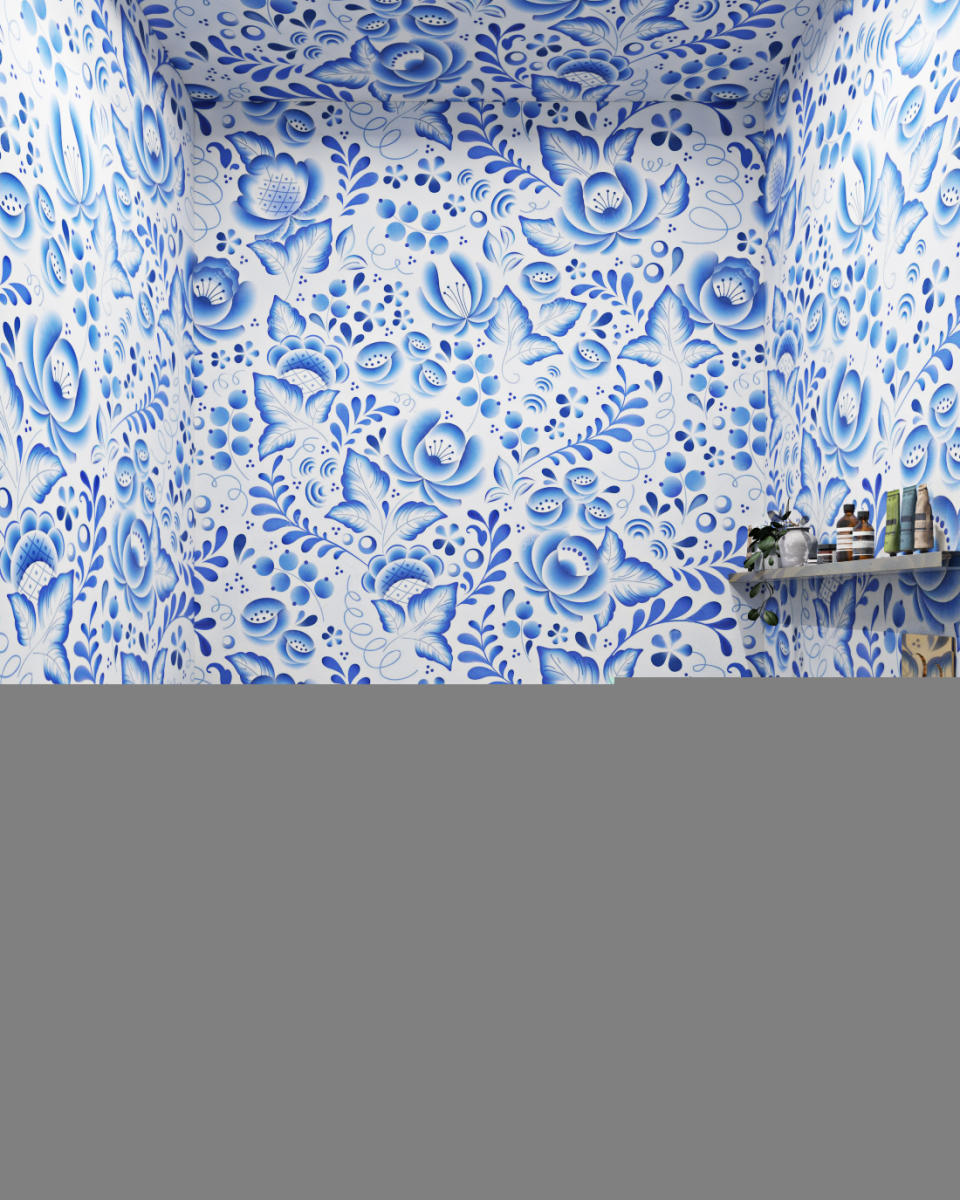 blue and white patterned wallpaper on the walls and ceiling of a modern bathroom