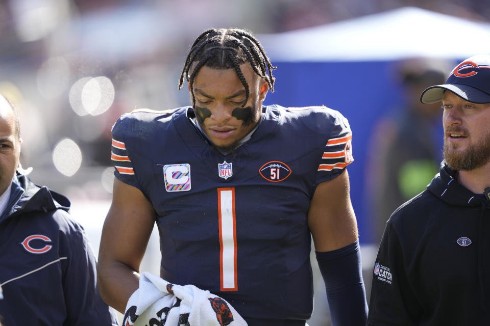 Chicago Bears quarterback Justin Fields walks to the locker room after being sacked during the second half of an NFL football game against the Minnesota Vikings, Sunday, Oct. 15, 2023, in Chicago. (AP Photo/Charles Rex Arbogast)