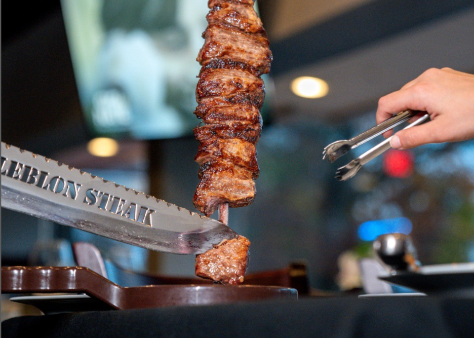 Leblon Steak offers a rodizio-style dining experience with grilled meats carved tableside from large skewers.