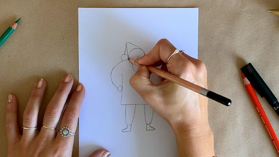 a person drawing santa's hat