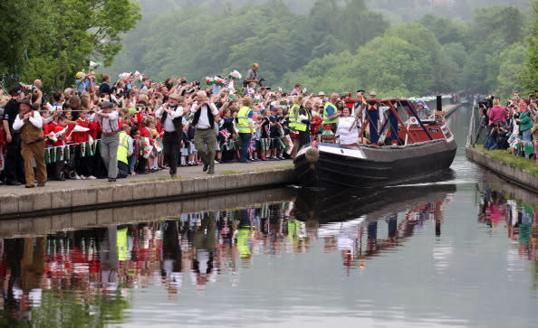 Joanne Gregory, Torchbearer 024, travels by barge across the Pontcysyllte Aqueduct with the Olympic Flame during the leg between Wrexham and Trevor in North Wales on day 12 of the London 2012 Olympic Torch Relay on May 30, 2012 in Wales. The Olympic Flame is now on day 12 of a 70-day relay involving 8,000 torchbearers covering 8,000 miles. (Photo by LOCOG via Getty Images)