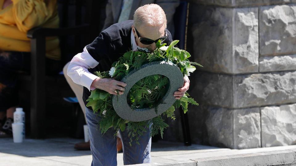 A woman kisses a wreath at the Garden of Remembrance in Dublin