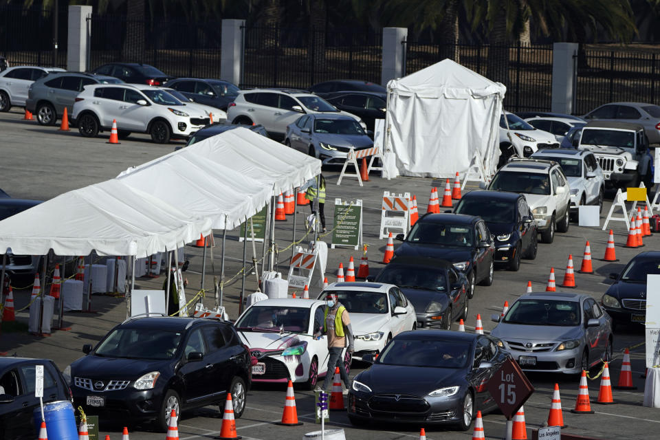 Motorists line up to take a COVID-19 test Tuesday, Jan. 5, 2021, in Los Angeles. (AP Photo/Marcio Jose Sanchez)