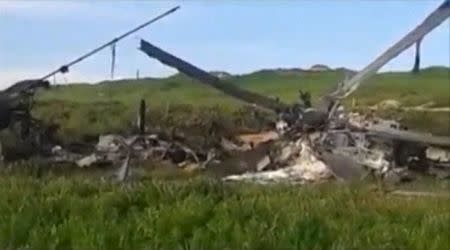 The wreckage of an Azeri Mi-24 helicopter which was downed during clashes with Armenian forces in Nagorno-Karabakh region, which is controlled by separatist Armenians, is seen in this still image taken from video provided by the Nagorno-Karabakh region Defence Ministry April 2, 2016. REUTERS/Nagorno-Karabakh Military Handout via Reuters TV