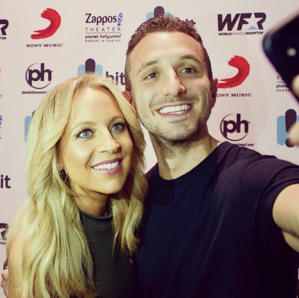 Tommy Little and his radio co-host Carrie Bickmore take a selfie at an event in 2018