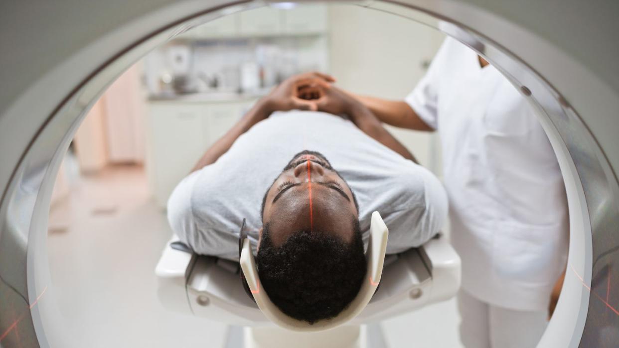 male patient undergoing mri scan in medical examination room