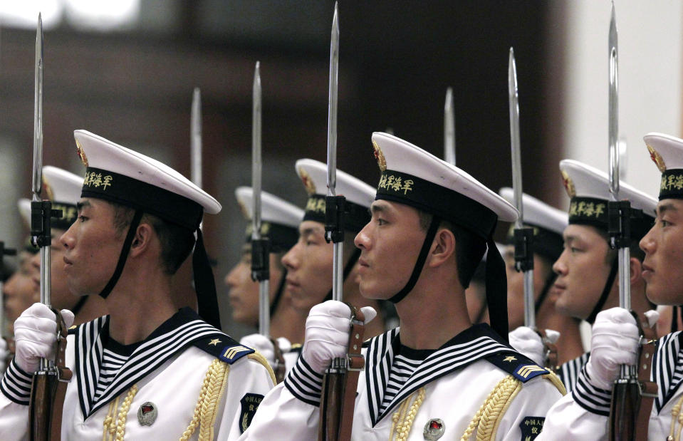 A guard of honor rehearses before the arrival of German Chancellor Angela Merkel outside the Great Hall of the People in Beijing Thursday, Aug. 30, 2012. (AP Photo/Ng Han Guan)