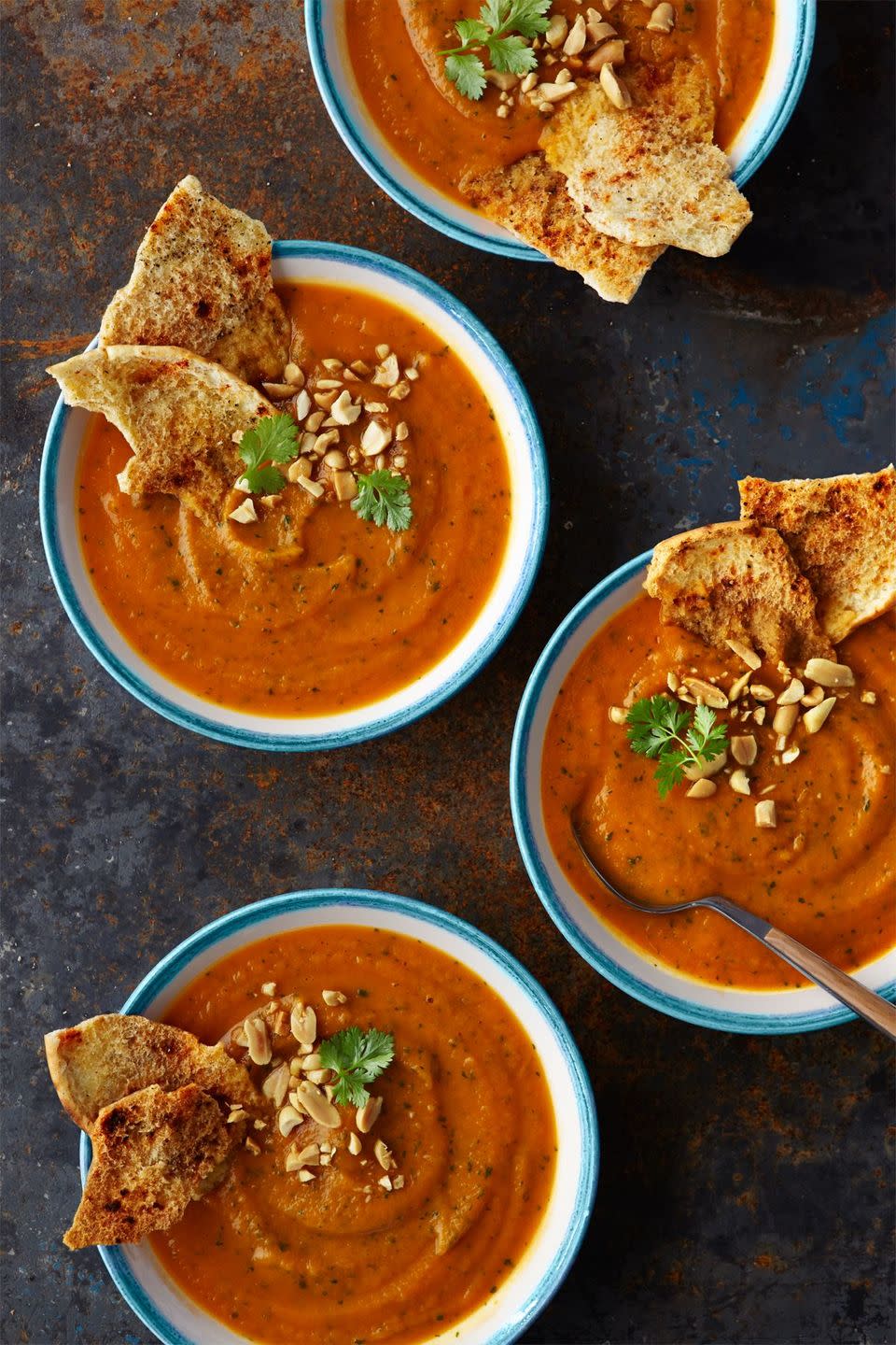 <p>Sweet potato makes the base of this hearty soup, but it's the ginger, peanut butter, and tomatoes that really make the flavors pop.</p><p><strong><a href="https://www.countryliving.com/food-drinks/recipes/a36484/spiced-sweet-potato-and-peanut-puree/" rel="nofollow noopener" target="_blank" data-ylk="slk:Get the recipe for Sweet Potato Soup with Peanuts and Ginger;elm:context_link;itc:0;sec:content-canvas" class="link ">Get the recipe for Sweet Potato Soup with Peanuts and Ginger</a>.</strong></p>