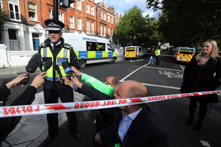 Deputy Chief Constable Adrian Hanstock of the British Transport Police makes a statement to the media after an incident at Parsons Green underground station in London, Britain, September 15, 2017. REUTERS/Luke MacGregor