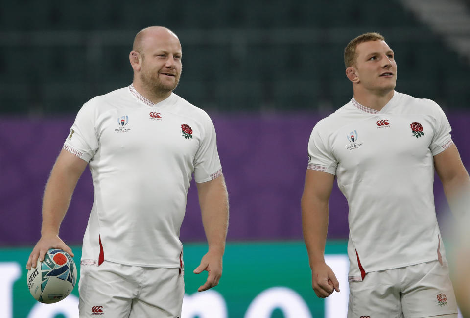 England's Dan Cole, left, and Sam Underhill attend a training session in Oita, Japan, Friday, Oct. 18, 2019. England will face Australia in the quarterfinals at the Rugby World Cup on Oct. 19. (AP Photo/Christophe Ena)