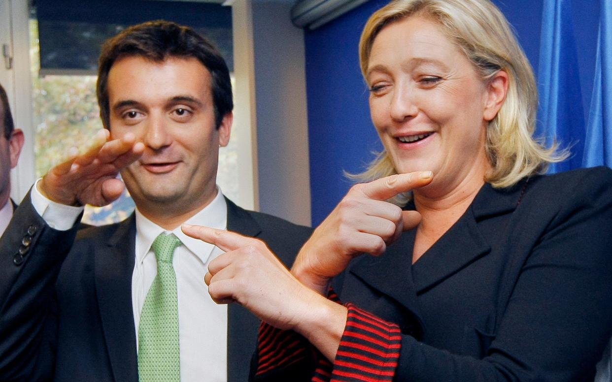 French far-right Front National party leader Marine Le Pen and her director for strategy Florian Philippot - AP