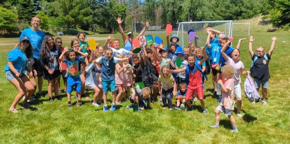 NORA Recreational Summer School participants celebrate after playing pickleball at Mike Herman Park in Ferrysburg.