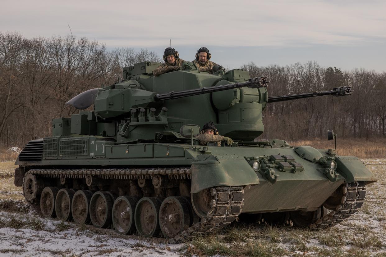 Ukrainian crew members sit in a German Gepard anti-aircraft-gun tank that is used to target Russian launched drones, during the vehicle's demonstration to the media, in the outskirts of Kyiv, on November 30, 2023, amid the Russian invasion of Ukraine. (AFP via Getty Images)