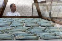 Artefacts discovered at an ancient burial site are seen inside a glass casing, on display near Egypt's Saqqara necropolis, in Giza Egypt July 14, 2018. REUTERS/Mohamed Abd El Ghany