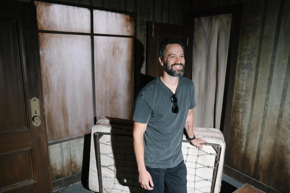 Neil Druckmann, writer of "The Last of Us," inside a haunted maze based on the video game at Universal Studios Hollywood.