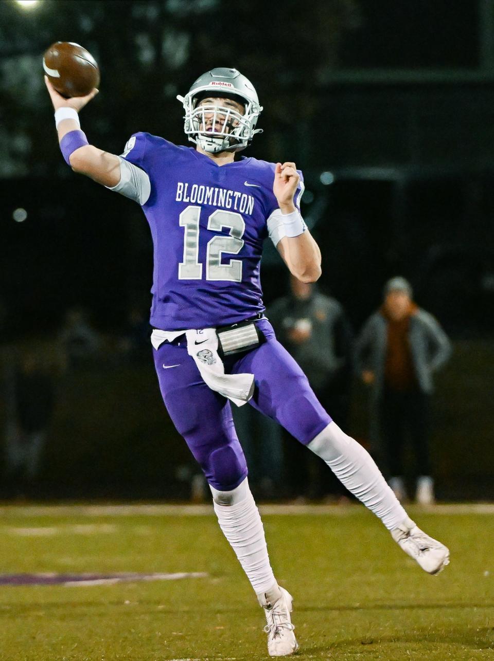 Bloomington South’s Jarrin Alley (12) throws a touchdown pass to Lucas Waldon during the IHSAA regional football game against Evansville North at South on Friday, Nov. 10, 2023.
