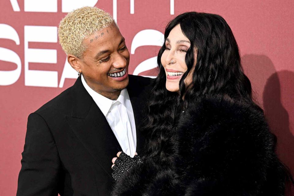 <p>STEFANO RELLANDINI/AFP via Getty</p> Alexander Edwards and Cher at Cannes amfAR Gala on May 23