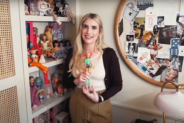 <p>Architectural Digest/YouTube</p> Emma Roberts' "doll wall"