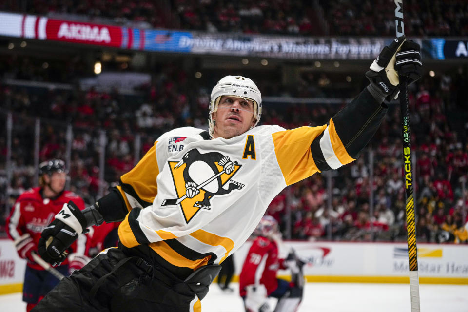 Pittsburgh Penguins center Evgeni Malkin celebrates after scoring in the second period of an opening night NHL hockey game against the Washington Capitals, Friday, Oct. 13, 2023, in Washington. (AP Photo/Andrew Harnik)