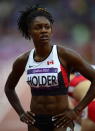 Canada's Nikkita Holder looks at the score board after competing in the women's 100-metre hurdle semifinals at the Olympic Stadium during the Summer Olympics in London on Tuesday, August 7, 2012. THE CANADIAN PRESS/Sean Kilpatrick