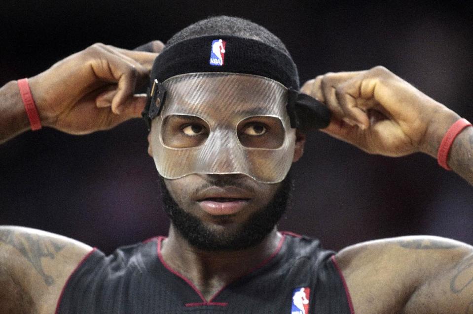 Miami Heat forward LeBron James (6) enters the game during the second quarter of an NBA basketball game against the Houston Rockets, Tuesday, March, 4, 2014, in Houston. (AP Photo/Patric Schneider)