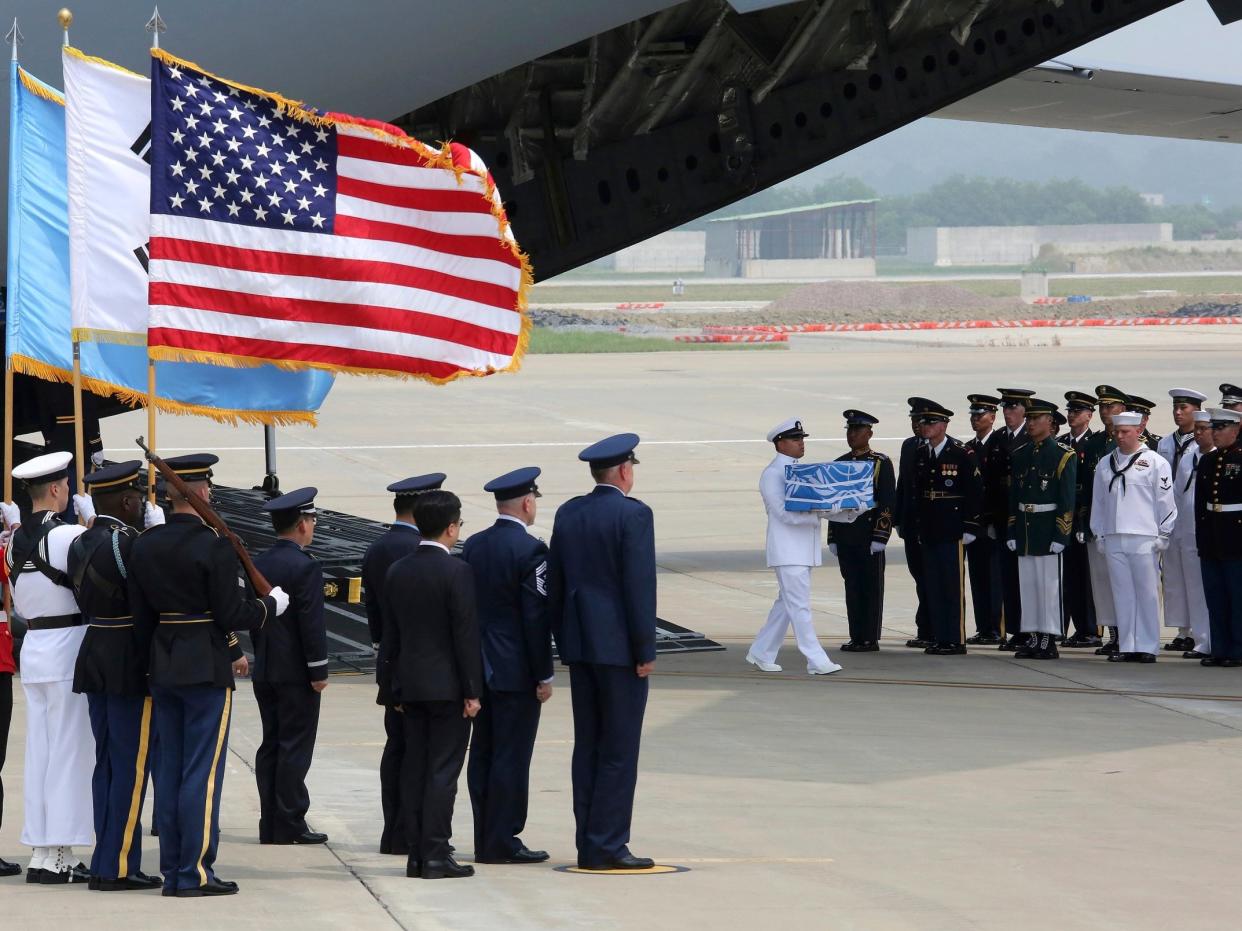 A UN honour guard at Osan air base in Pyeongtaek carries a casket containing remains believed to be from American servicemen killed during the 1950-53 Korean War after arriving from North Korea: AP