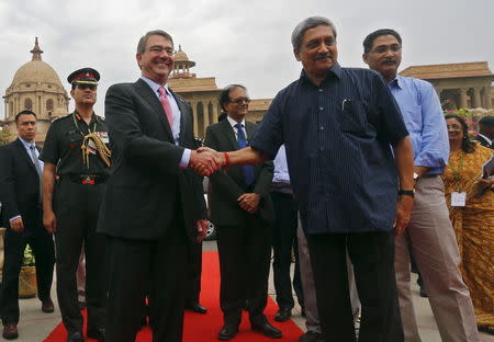 U.S. Defense Secretary Ash Carter (front, L) shakes hands with India’s Defence Minister Manohar Parrikar (front, R) during his ceremonial reception in New Delhi, India, June 3, 2015. REUTERS/Adnan Abidi