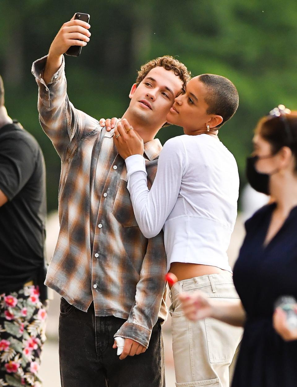 <p>Jordan Alexander and Eli Brown take selfies on set of the <em>Gossip Girl</em> reboot in Brooklyn on June 7. </p>