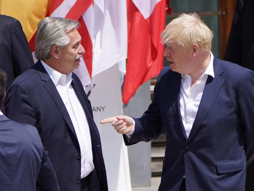 Prime Minister Boris Johnson (right) talks with Argentina’s President Alberto Fernandez (Stefan Rousseau/PA) (PA Wire)