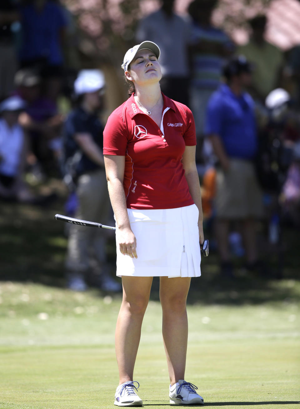 Caroline Masson, of Germany, reacts to missing a putt on the ninth hole during the third round of the North Texas LPGA Shootout golf tournament at Las Colinas Country Club in Irving, Texas, Saturday, May 3, 2014. (AP Photo/LM Otero)