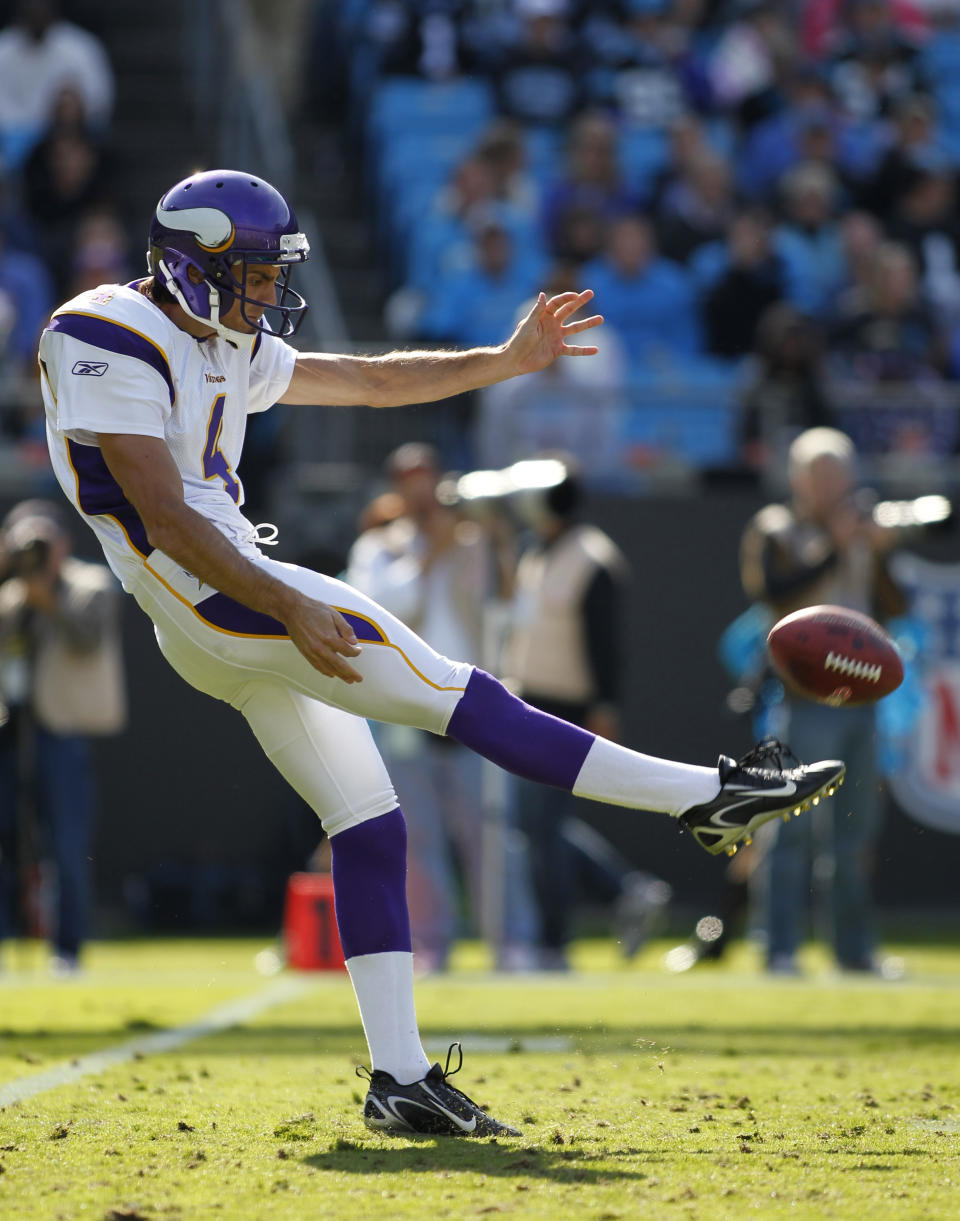 In this Oct. 30, 2011, photo, Minnesota Vikings' Chris Kluwe punts to the Carolina Panthers during an NFL football game in Charlotte, N.C. Kluwe, who is no longer with the Vikings, says the team's special teams coordinator, Mike Priefer, made anti-gay comments while Kluwe was with the team. (AP Photo/Bob Leverone)