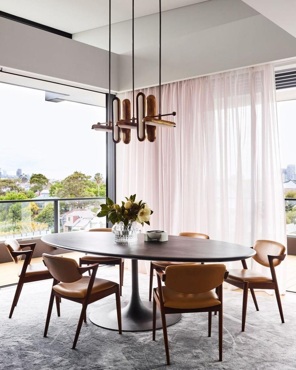 a dining table with chairs around it