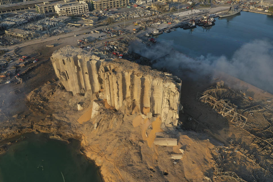 In this drone picture, the destroyed silo sits in rubble and debris after an explosion at the seaport of Beirut, Lebanon, Lebanon, Wednesday, Aug. 5, 2020. The massive explosion rocked Beirut on Tuesday, flattening much of the city's port, damaging buildings across the capital and sending a giant mushroom cloud into the sky. (AP Photo/Hussein Malla)