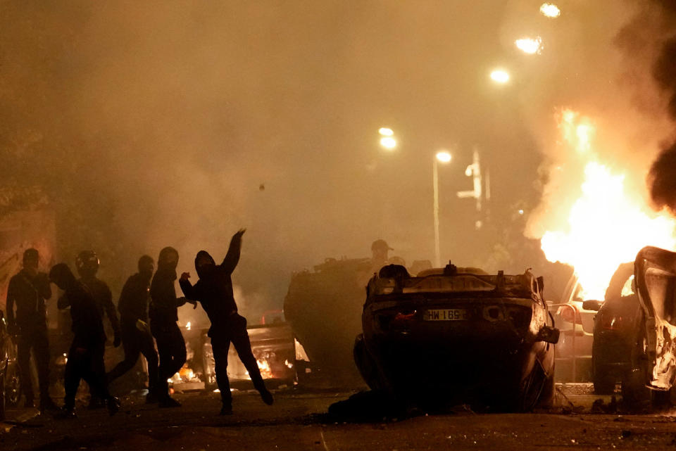 Youth clash with police forces in Nanterre, outside Paris, on June 29, 2023.<span class="copyright">Christophe Ena—AP</span>